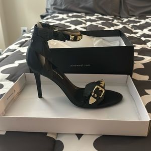 Nine West, black leather heels with gold on them, brand new, size 8